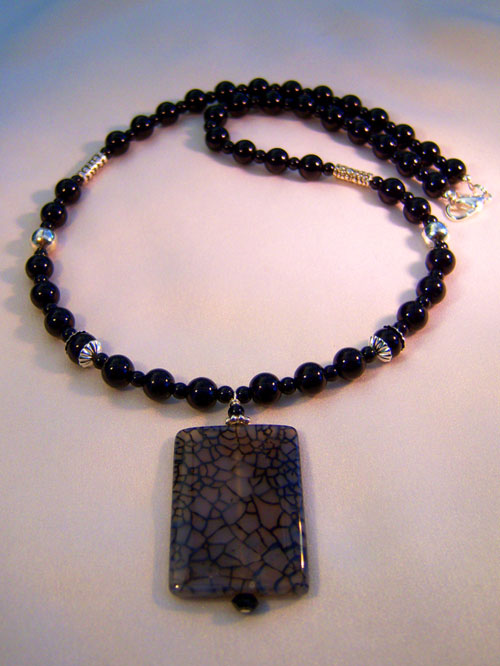 444n - 22 inch handcrafted necklace, dragon vein pendant, black glass and silver plate beads